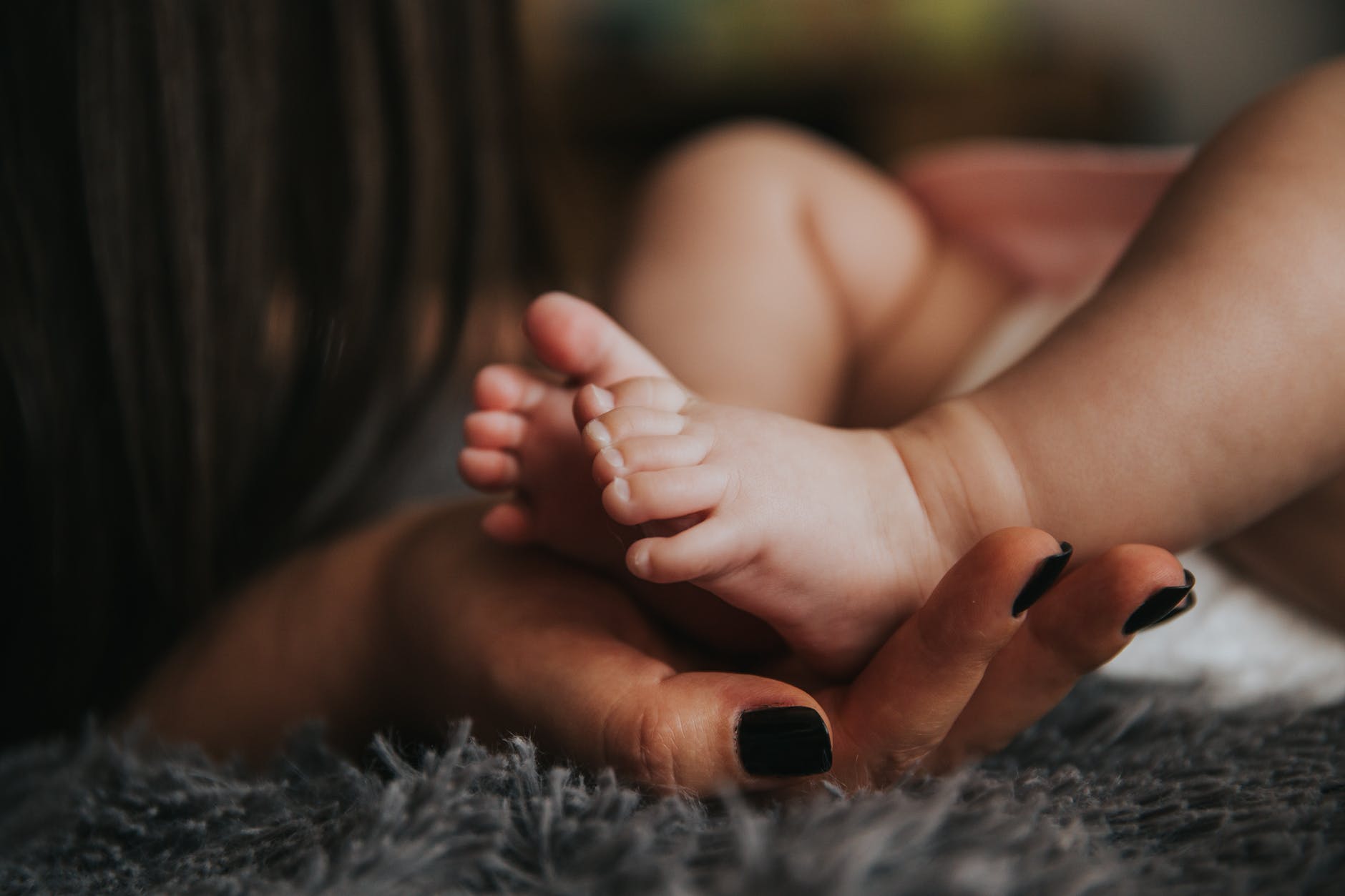 affection baby barefoot blur parenting grief