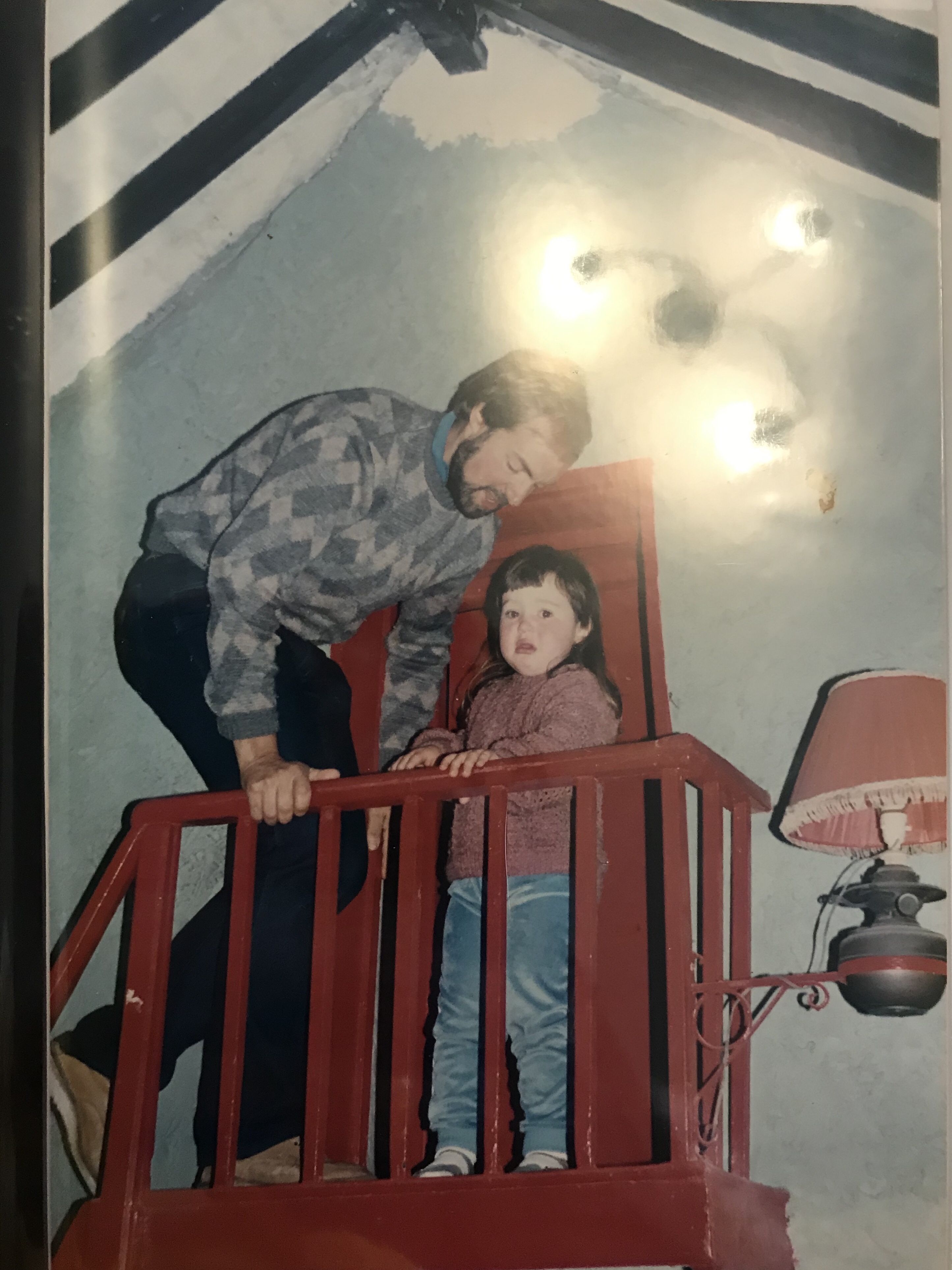 A letter to my Dad - Scared child on a set of red stairs with an adult