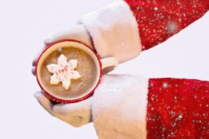 person holding cup of hot chocolate