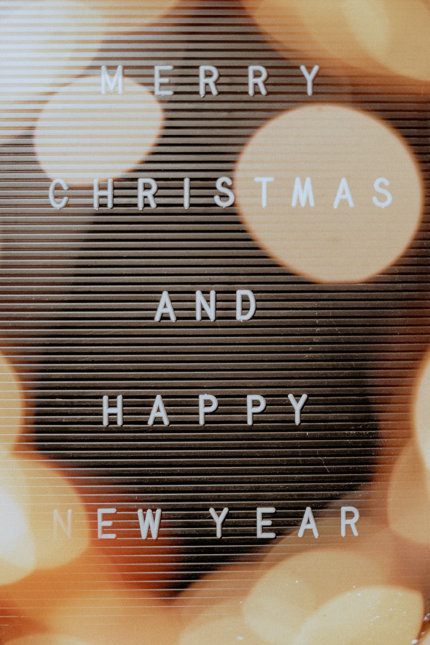 brown and black bokeh photography with white text