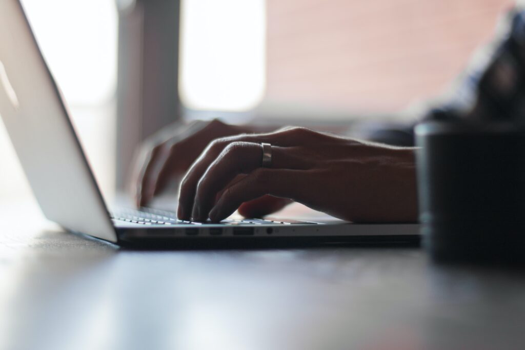 Typing on a laptop 