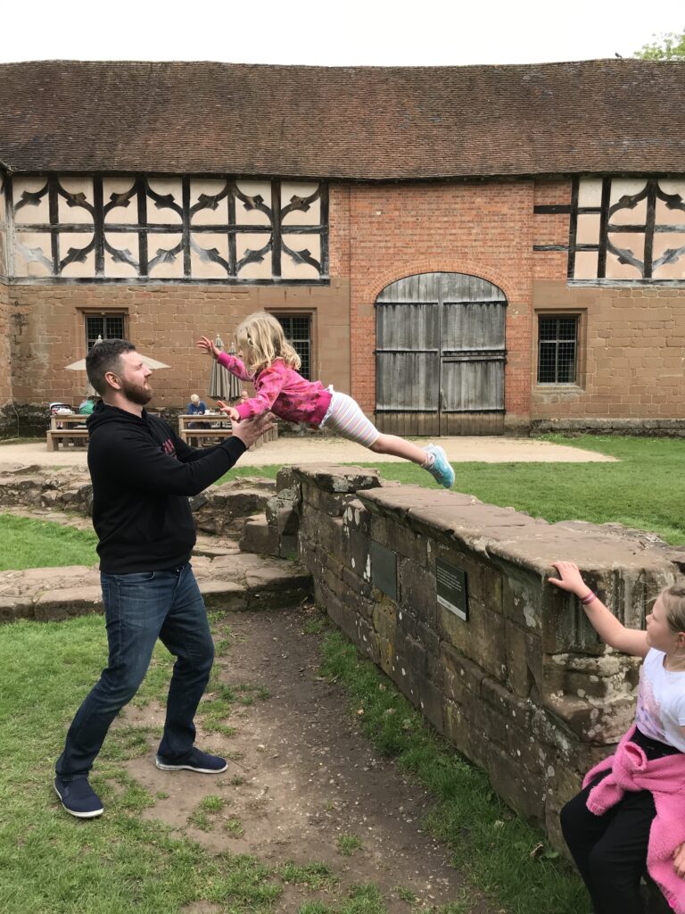 Child jumping in to fathers arms