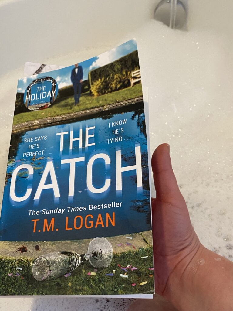 A book on the edge of a bubble bath