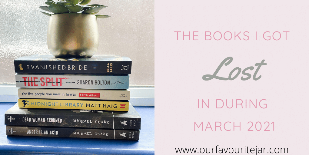 Pile of books with gold pot and green succulent in