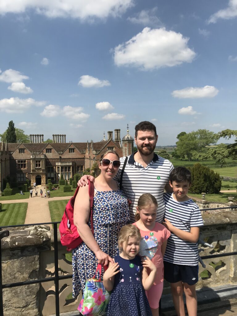 Family of 5 with Charlecote house in the background